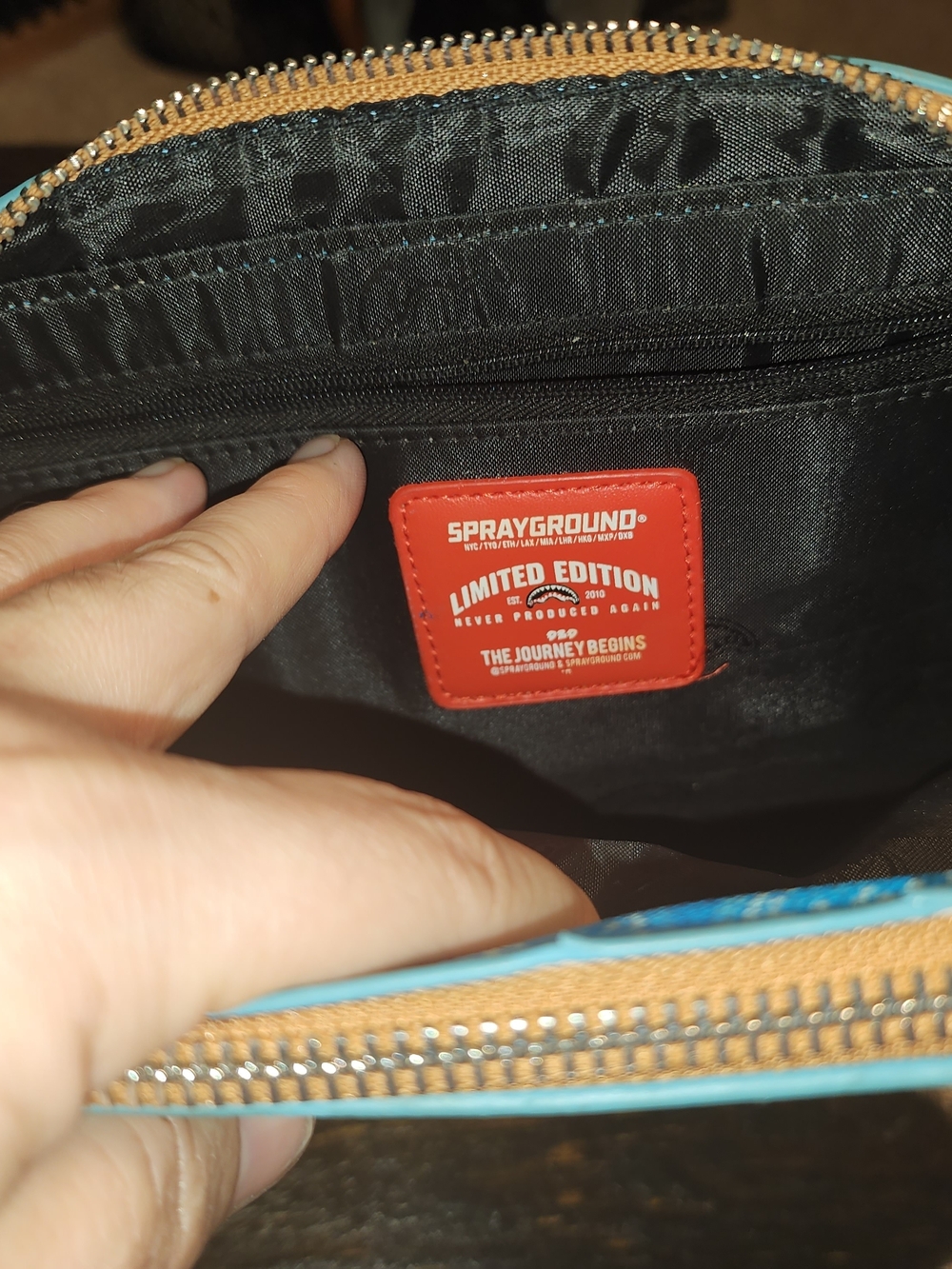 Sprayground Limited Edition Black Toiletry Pouch with Red Logo and Blue Trim